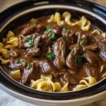 Slow cooker beef and noodles with fall-apart beef, wide egg noodles, and rich gravy