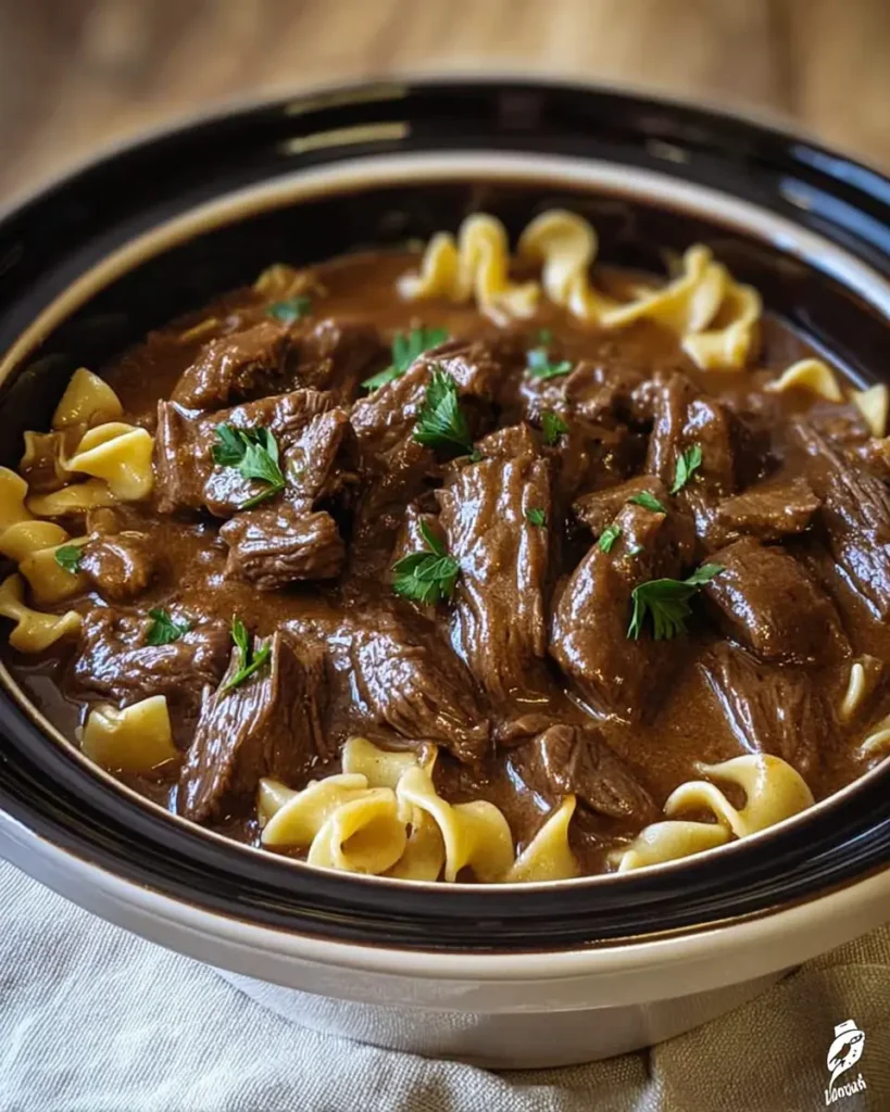 Slow cooker beef and noodles with fall-apart beef, wide egg noodles, and rich gravy