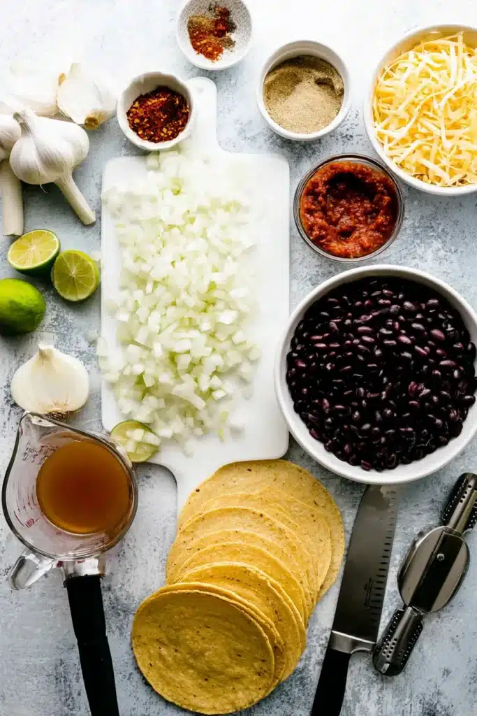 slow cooker ranch chicken tacos served in warm tortillas with creamy shredded chicken, lime wedges, and cilantro
