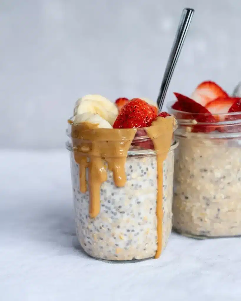 High-protein overnight oats in a jar with peanut butter and strawberries
