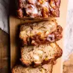 Top view of sliced Amish apple fritter bread with caramelized apple topping and vanilla glaze.