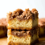Stacked apple crumb cake squares with golden crumb topping