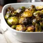 Roasted balsamic glazed Brussels sprouts in ceramic dish