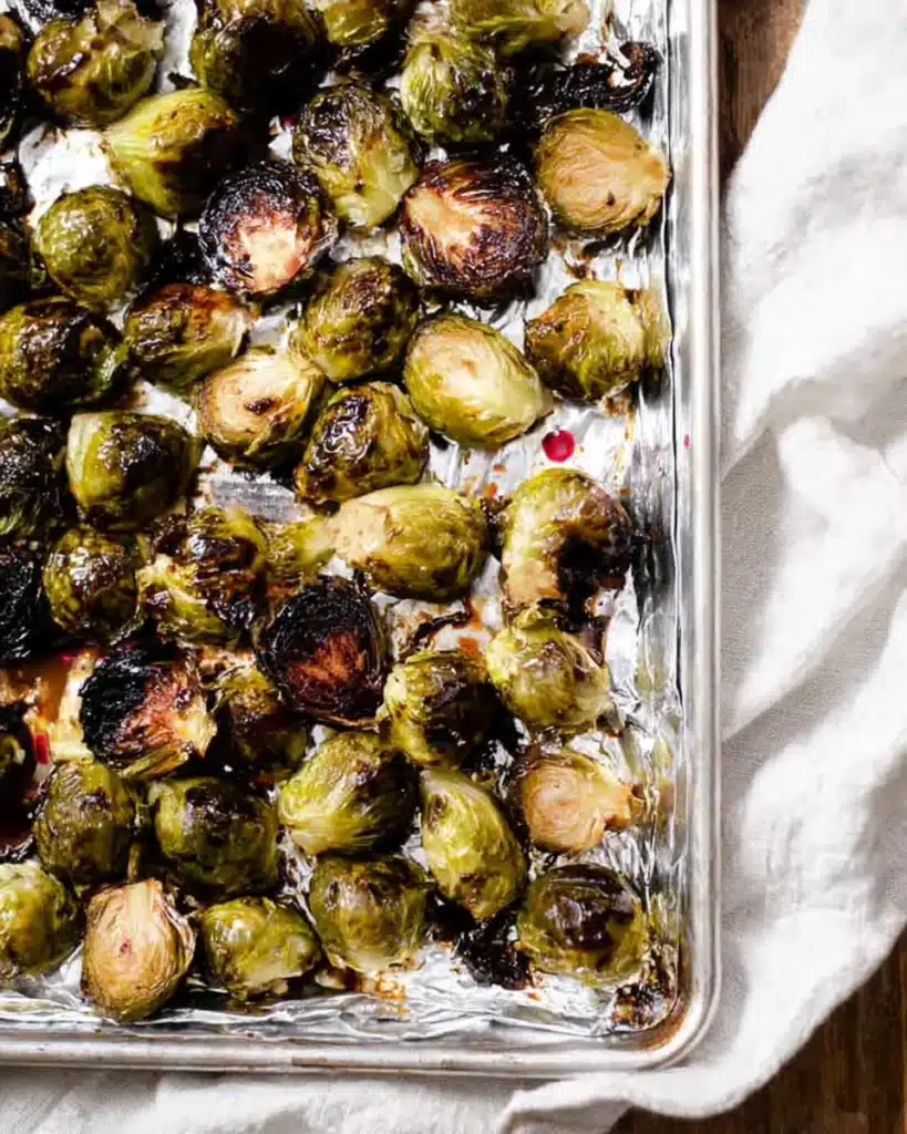 Roasted balsamic glazed Brussels sprouts on a baking sheet