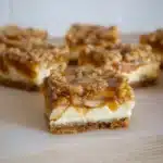 Caramel apple cheesecake bars recipe with streusel topping and glossy caramel drizzle.
