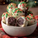 Festive chocolate bites with sprinkles in ceramic bowl