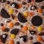 Close-up of Halloween Oreo bark with candy eyeballs and sprinkles
