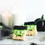 Frankenstein Halloween Rice Krispie treats with green candy coating and candy eyes