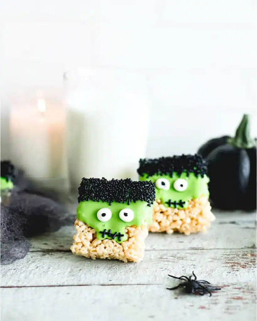 Frankenstein Halloween Rice Krispie treats with green candy coating and candy eyes