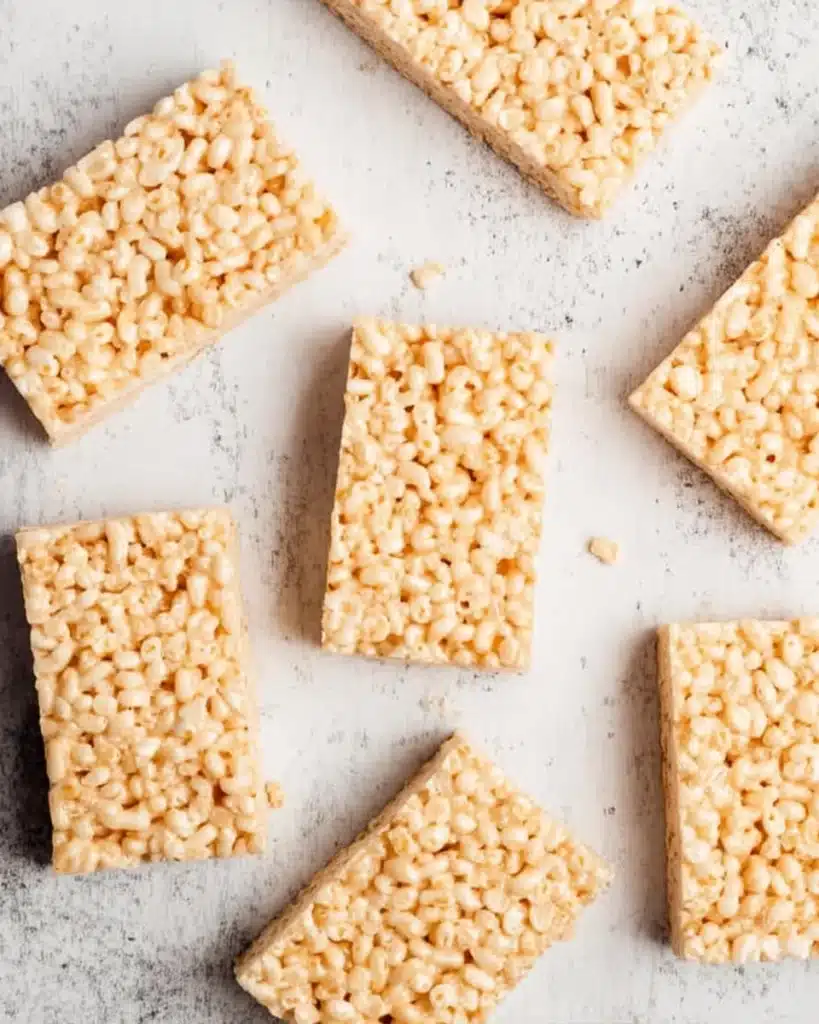 Cut Frankenstein Halloween Rice Krispie bars on a light surface