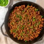 Finished ginger honey ground pork with sesame and green onion in skillet