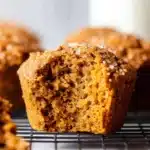 Moist inside of healthy pumpkin muffin with bite taken out