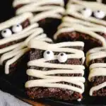 Halloween mummy brownies with white chocolate drizzle and candy eyes