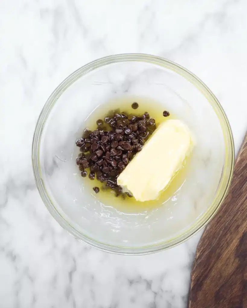 Mummy Brownies step with butter and chocolate chips in glass bowl