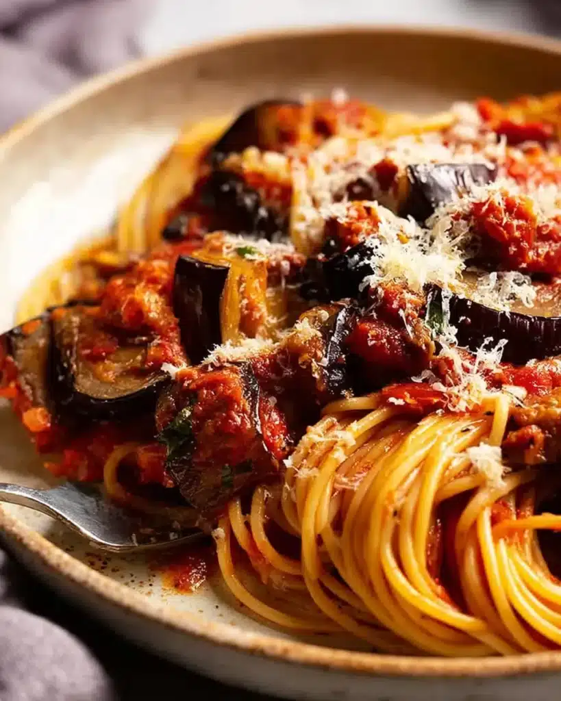 Pasta alla Norma with roasted eggplant, tomato sauce, and cheese