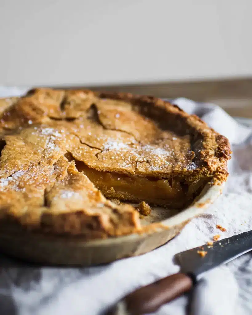 Close-up salted maple pie with gooey filling and flaky crust
