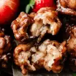 Homemade apple fritters with caramelized apple filling and glaze