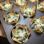 Crispy spinach and artichoke wonton cups baked in a muffin tin