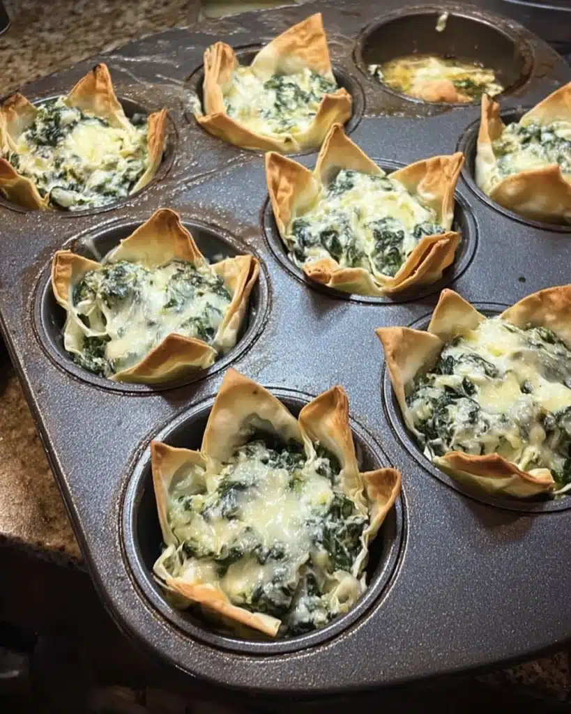 Crispy spinach and artichoke wonton cups baked in a muffin tin