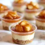 Close-up of caramel apple dessert cups with creamy mousse and apple topping