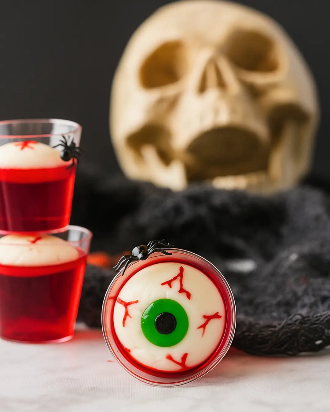 Close-up of Jello Shot Eyeballs with red gelatin and lychees for Halloween