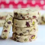 Stack of cranberry pistachio shortbread cookies on a festive white cloth – Shortbread Cookies Recipe"