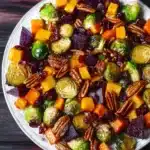 Winter Vegetable Salad with roasted Brussels sprouts, beets, butternut squash, pecans, and cranberries.