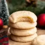 Stack of chewy sugar cookies with a bite taken out, holiday background