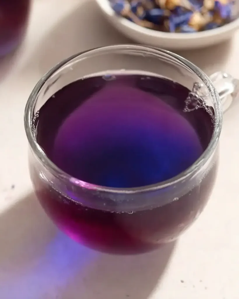 Glass cup of purple butterfly pea flower tea for Natural Mounjaro Recipe