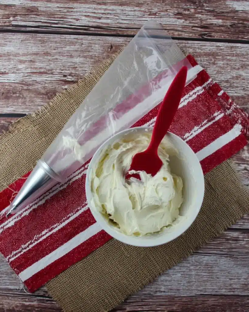 Whipped cream cheese filling with piping bag for Strawberry Santas