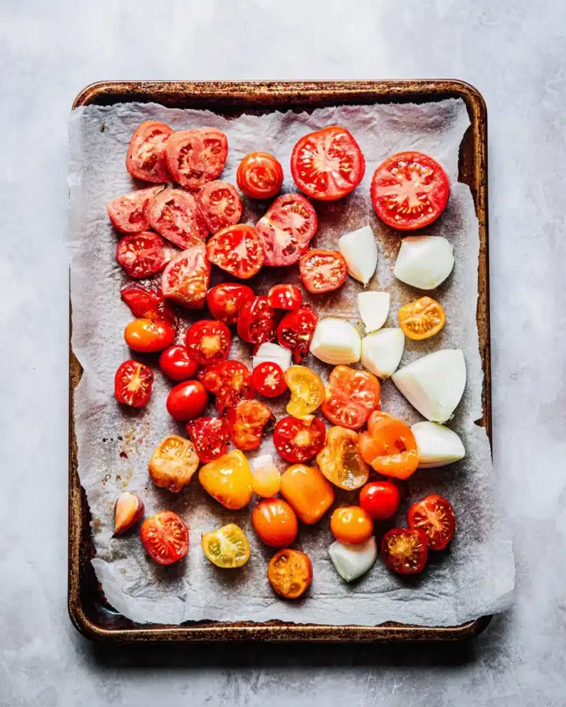 Fresh tomatoes, bell peppers, garlic, and onions for tomato bisque soup