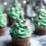 Easy Christmas tree cupcakes with green frosting and powdered sugar snow