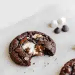 Bitten hot chocolate cookie with gooey marshmallow center